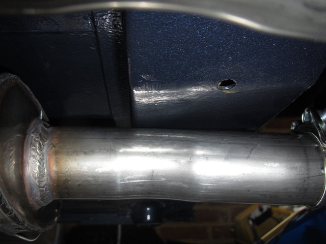 The output pipes from the muffler section foul the rear floor stiffener so something's amiss