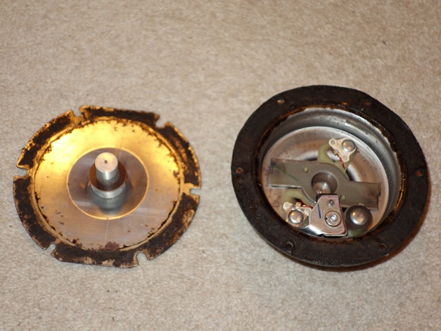 The diaphragm removed, showing its ferrous attachment and disc operating to operate the contact points