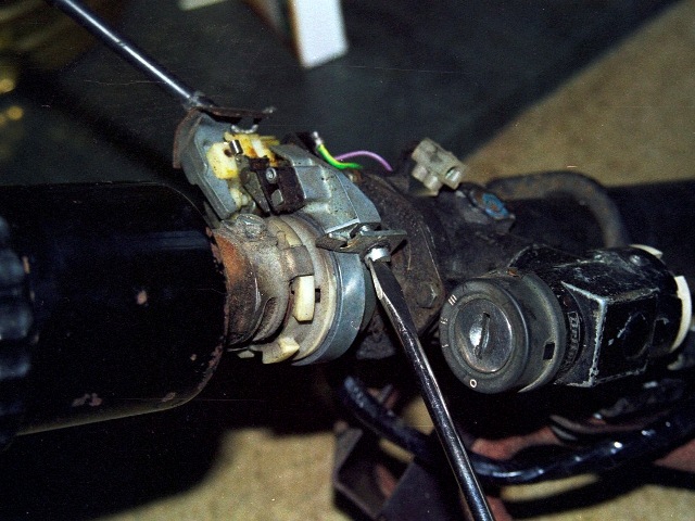 Removal of the semi-circular bracket securing the indicator mechanism to the steer column housing