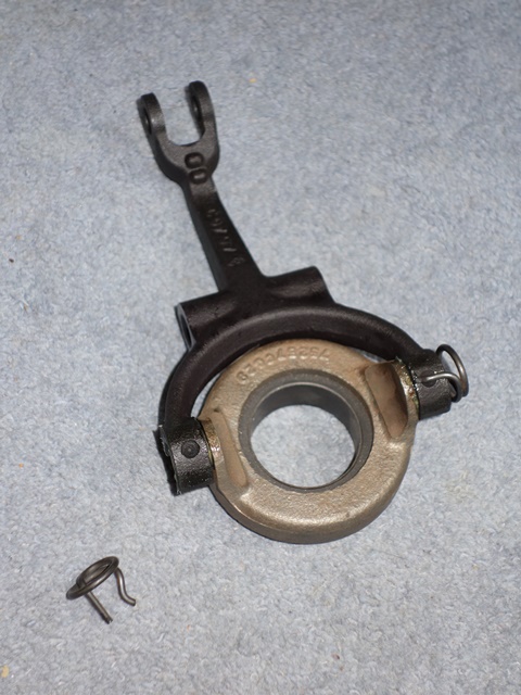 The push-fit spring clips secure the clutch release bearing to the operating fork. The curved spring end sits in a dimple in the fork