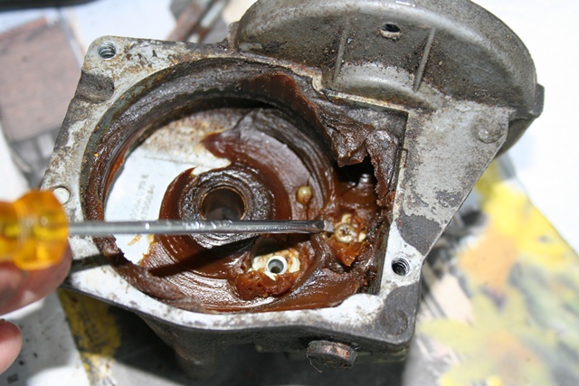 The removal of the gear wheel provides access to the screws securing the parking switch unit